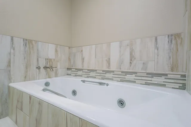 a view of kitchen with stainless steel appliances granite countertop cabinets and sink