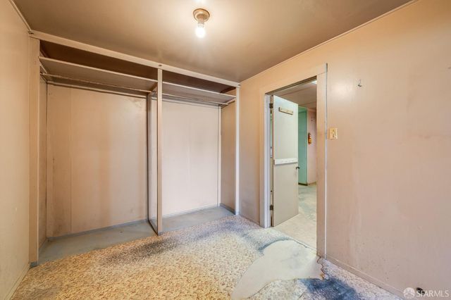 a view of hallway with wooden floor