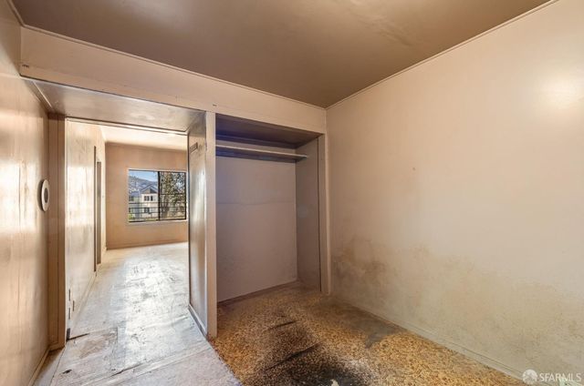 a view of kitchen with refrigerator and window