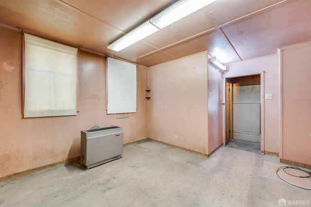 a kitchen with a stove and a refrigerator
