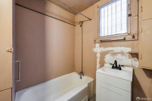 a dining room with furniture and a window