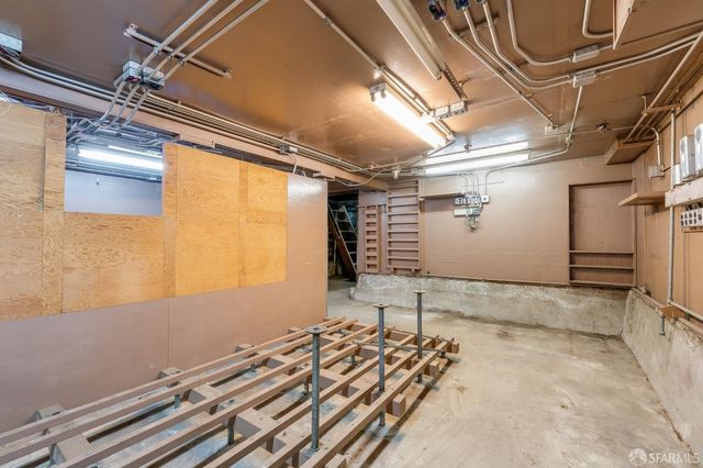 a front view of a building with trees