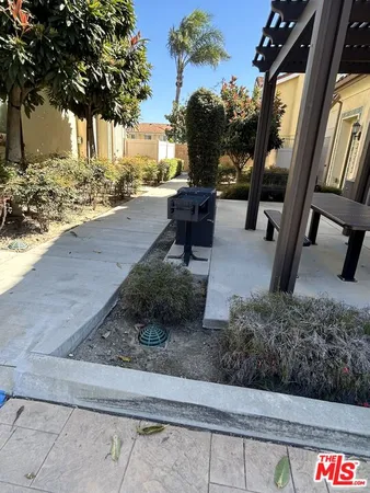 a view of a porch with furniture and next to a yard