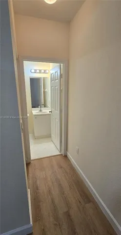a view of hallway with washer and dryer