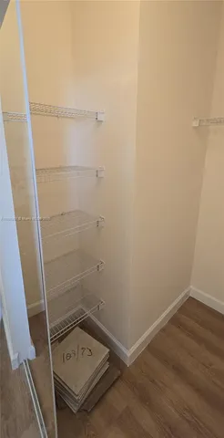 a bathroom with a sink a toilet a mirror a vanity and bathtub