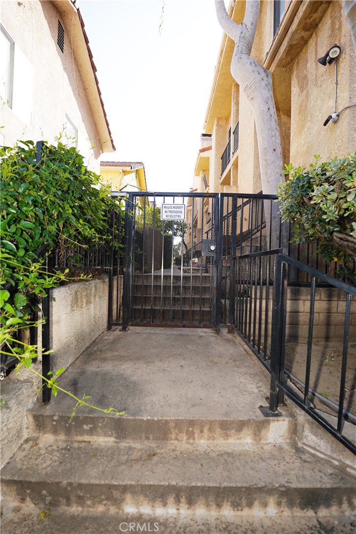 18954 Sherman Way, Unit 3 Reseda, CA 91335 - Photo 3 of 46 a view of a wrought iron fences in front of house