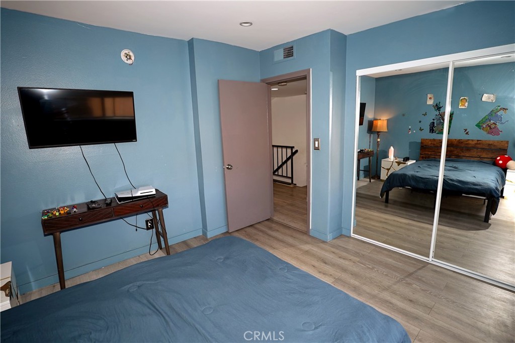 18954 Sherman Way, Unit 3 Reseda, CA 91335 - Photo 34 of 46 a living room with furniture and a flat screen tv