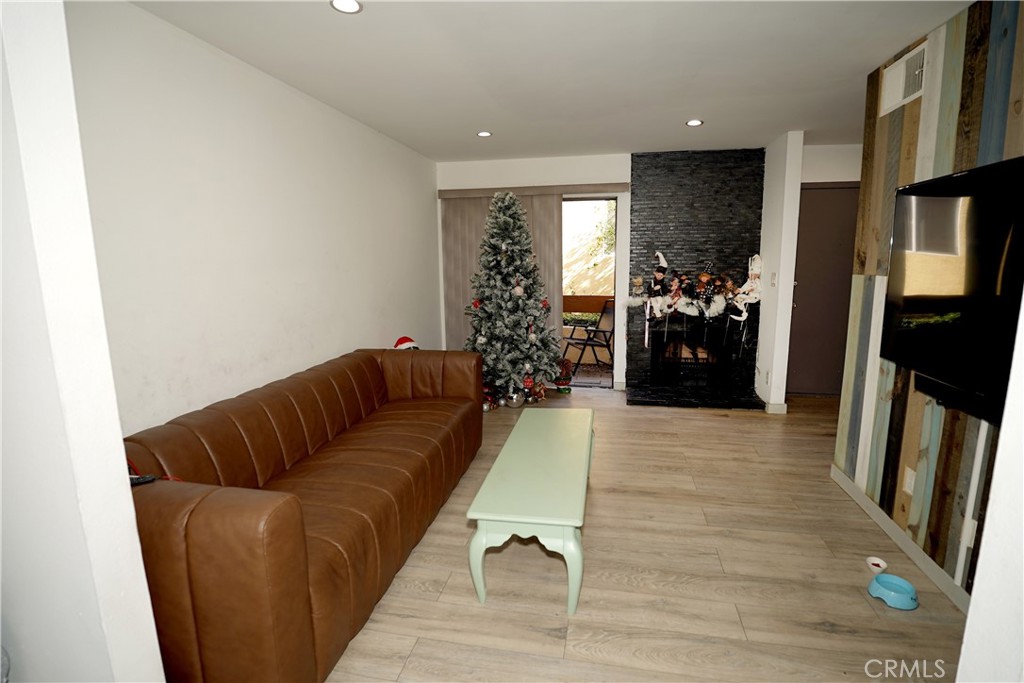 18954 Sherman Way, Unit 3 Reseda, CA 91335 - Photo 5 of 46 a living room with furniture flowerpot and a rug
