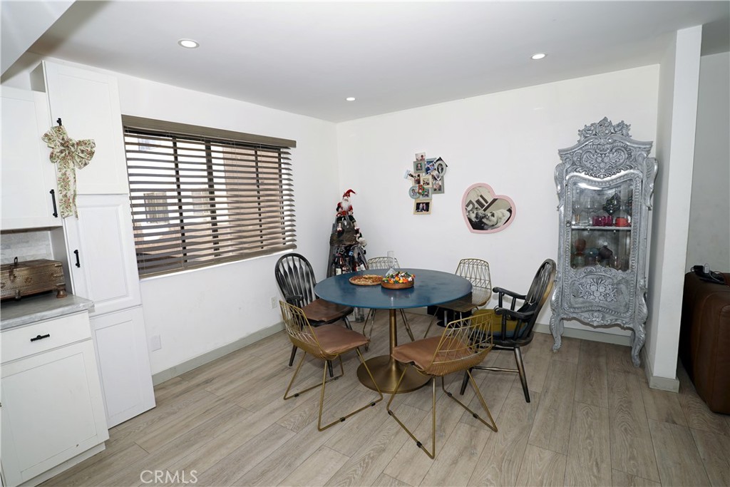 18954 Sherman Way, Unit 3 Reseda, CA 91335 - Photo 8 of 46 a view of a dining room with furniture window and wooden floor