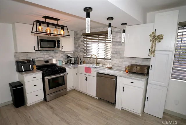 a bedroom with furniture and a flat screen tv