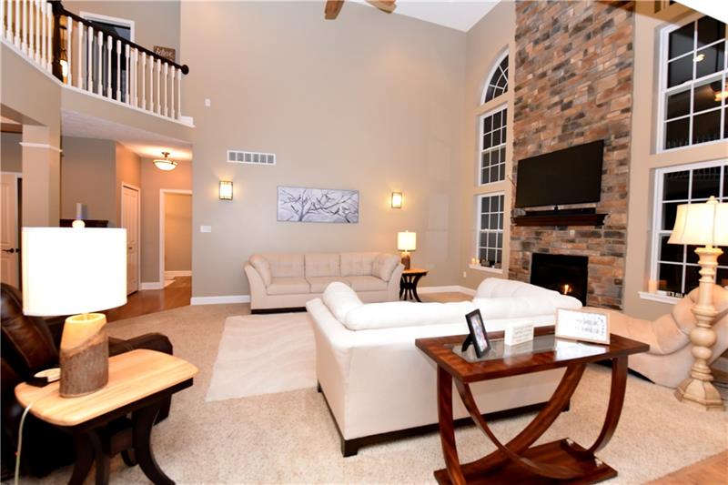 66 Pigeon Creek Road Eighty Four, PA 15330 - Photo 3 of 25 floor to ceiling stone fireplace outlined with pretty windows