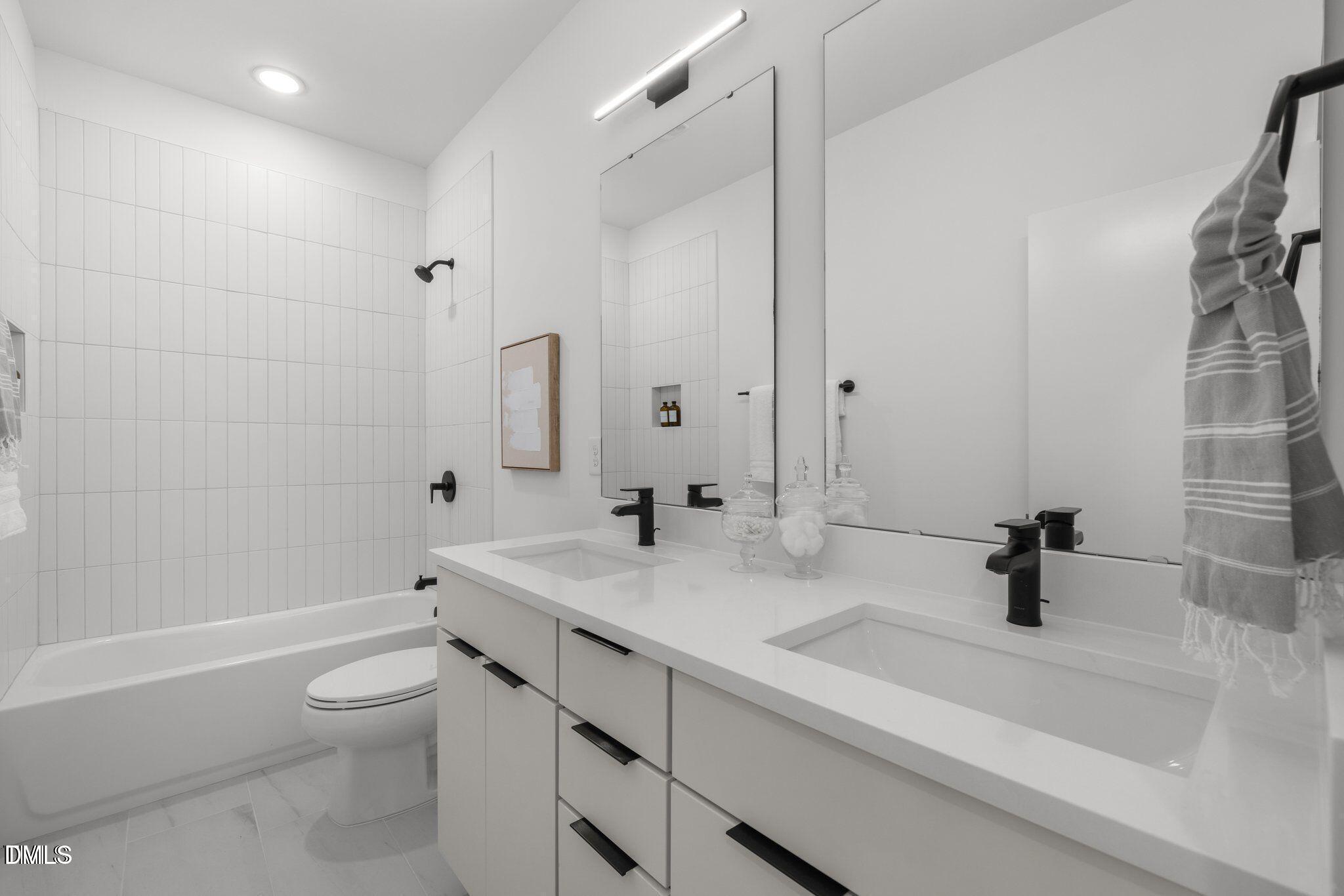516 Edgecreek Court Raleigh, NC 27604 - Photo 21 of 26 a bathroom with a sink a toilet and shower