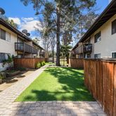 a backyard of a house with lots of green space