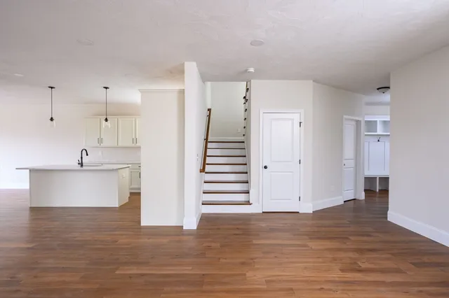 a view of a kitchen with wooden floor