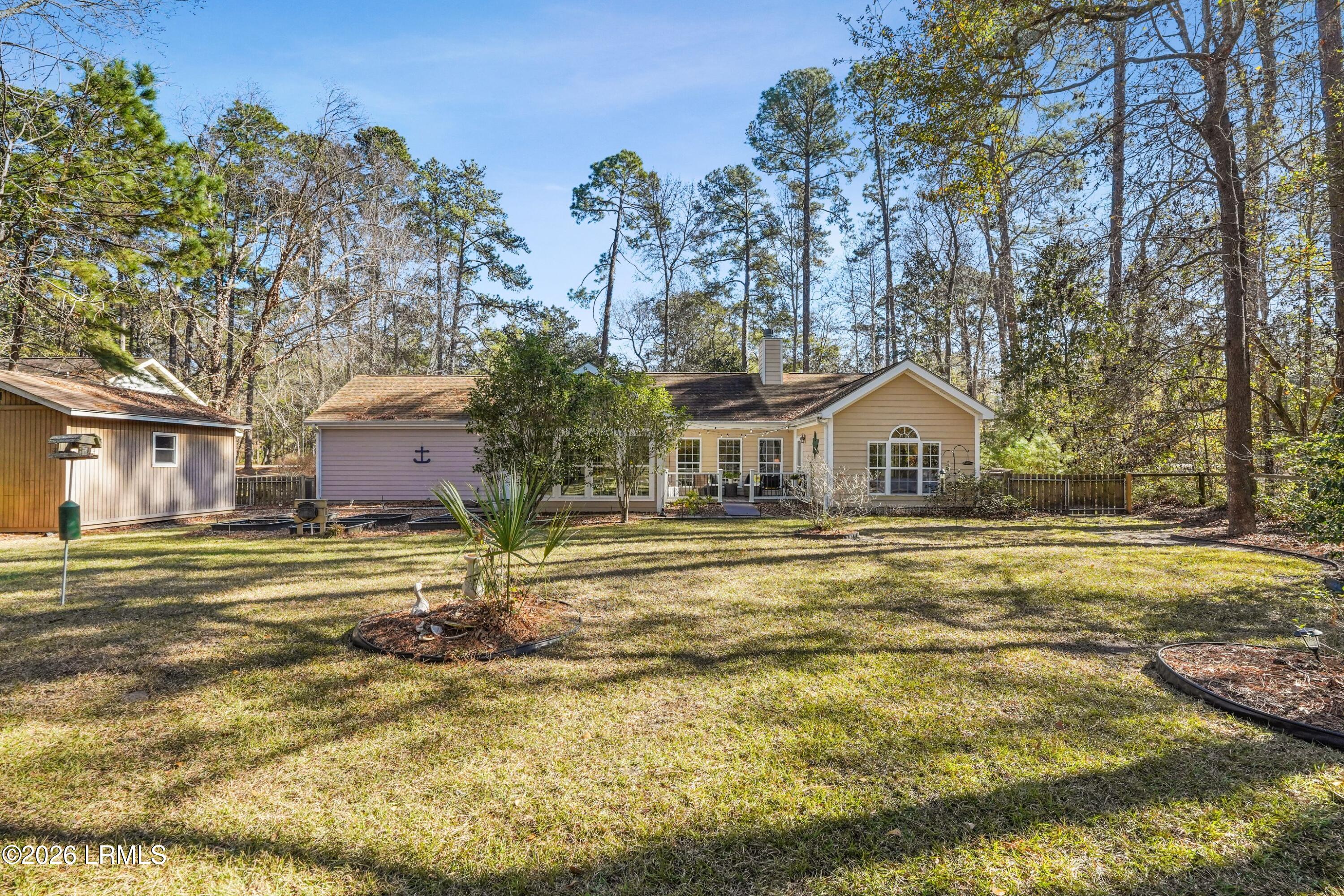 561 Sams Point Road Beaufort, SC 29907 - Photo 36 of 44 BACK VIEW OF HOME AND BACKYARD