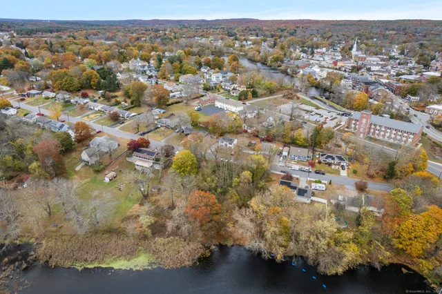 an aerial view of residential houses with city view