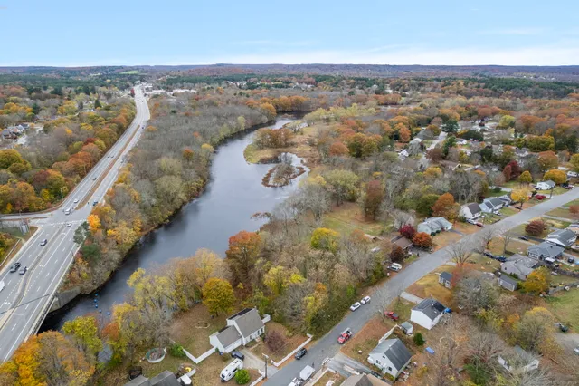 an aerial view of residential houses with outdoor space
