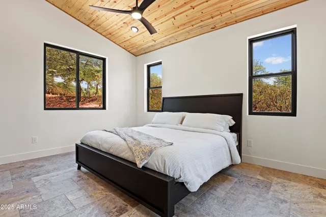 a bedroom with a bed and a view of bathroom