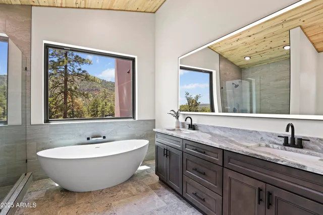 a bathroom with a bathtub and shower