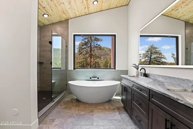 a hallway with white cabinets and a stove