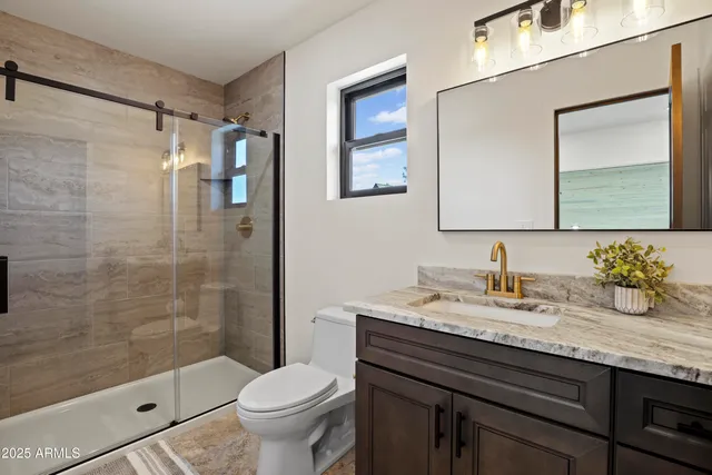 a view of a balcony with wooden floor and fence