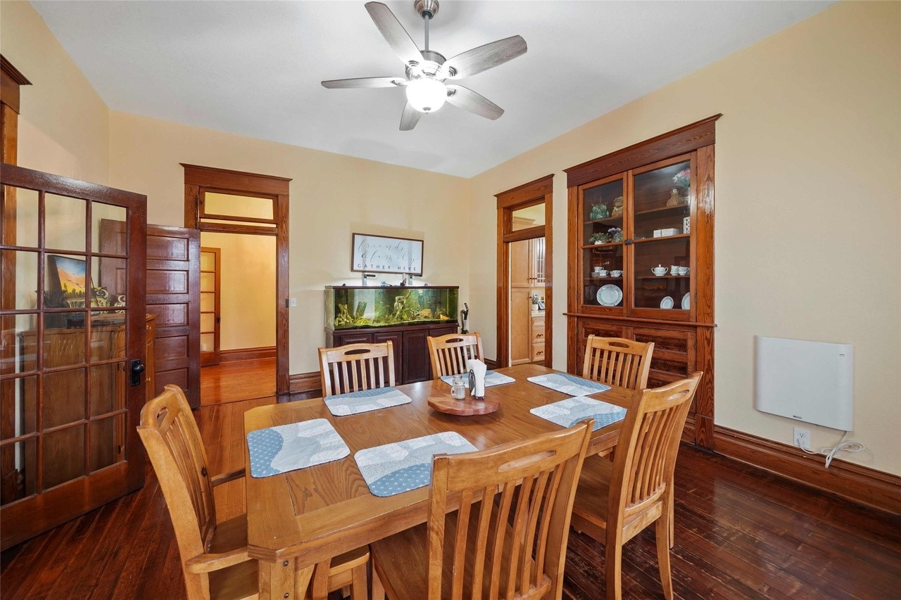 570 Wightman Street Matagorda, TX 77457 - Photo 11 of 29 a dining room with furniture a window and wooden floor