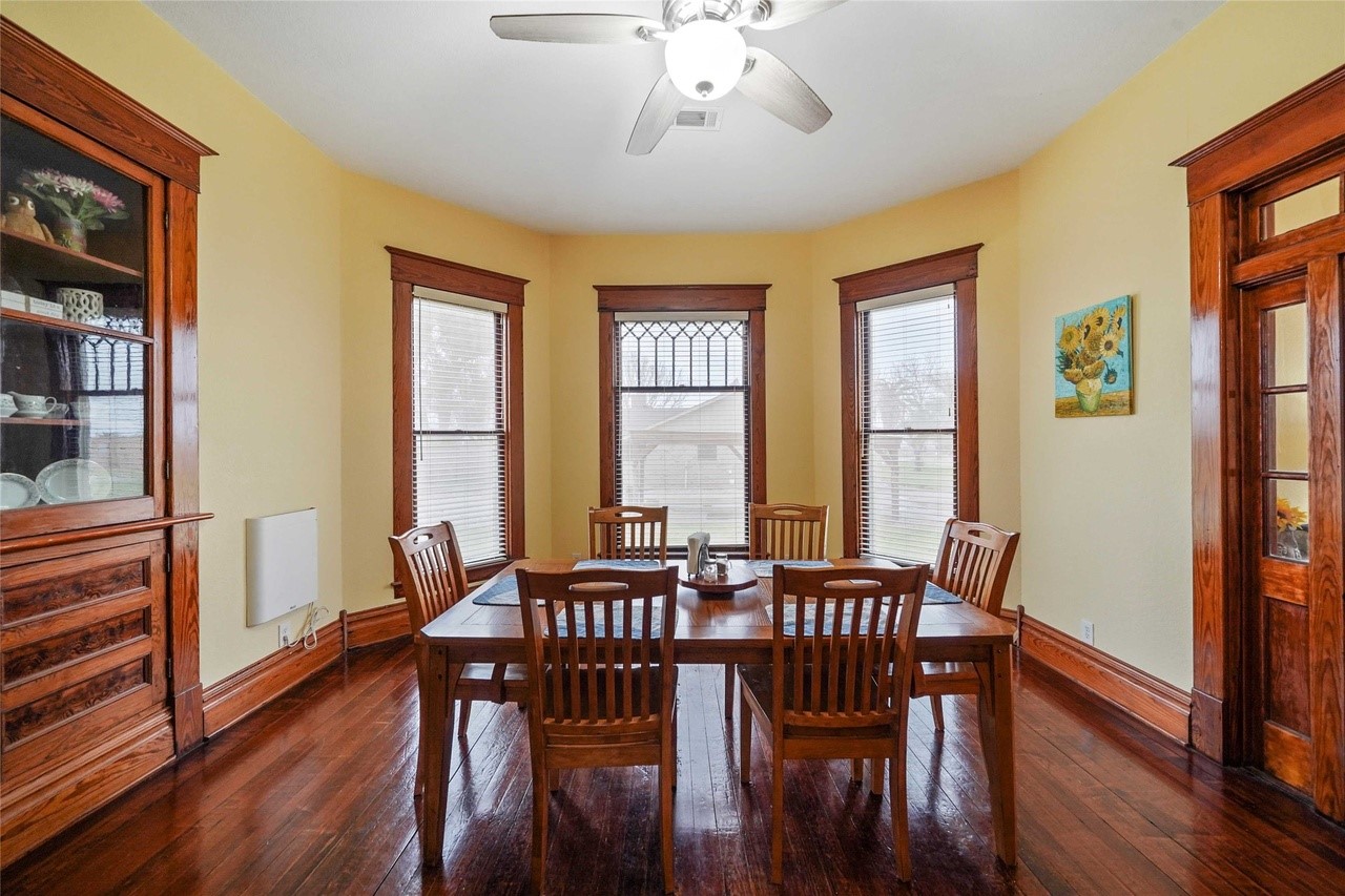 570 Wightman Street Matagorda, TX 77457 - Photo 12 of 29 a view of a a dining room with furniture window and wooden floor