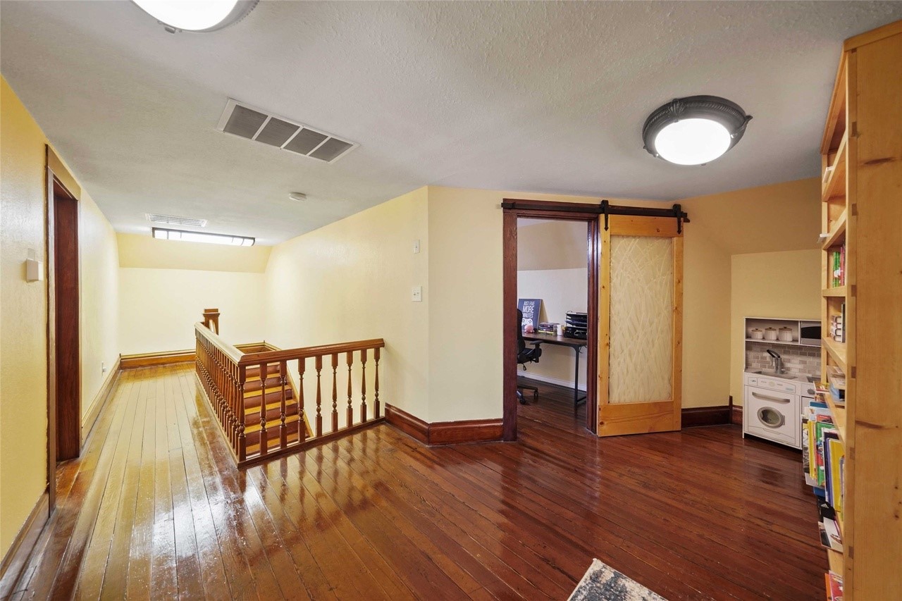 570 Wightman Street Matagorda, TX 77457 - Photo 23 of 29 a view of a livingroom with furniture and wooden floor
