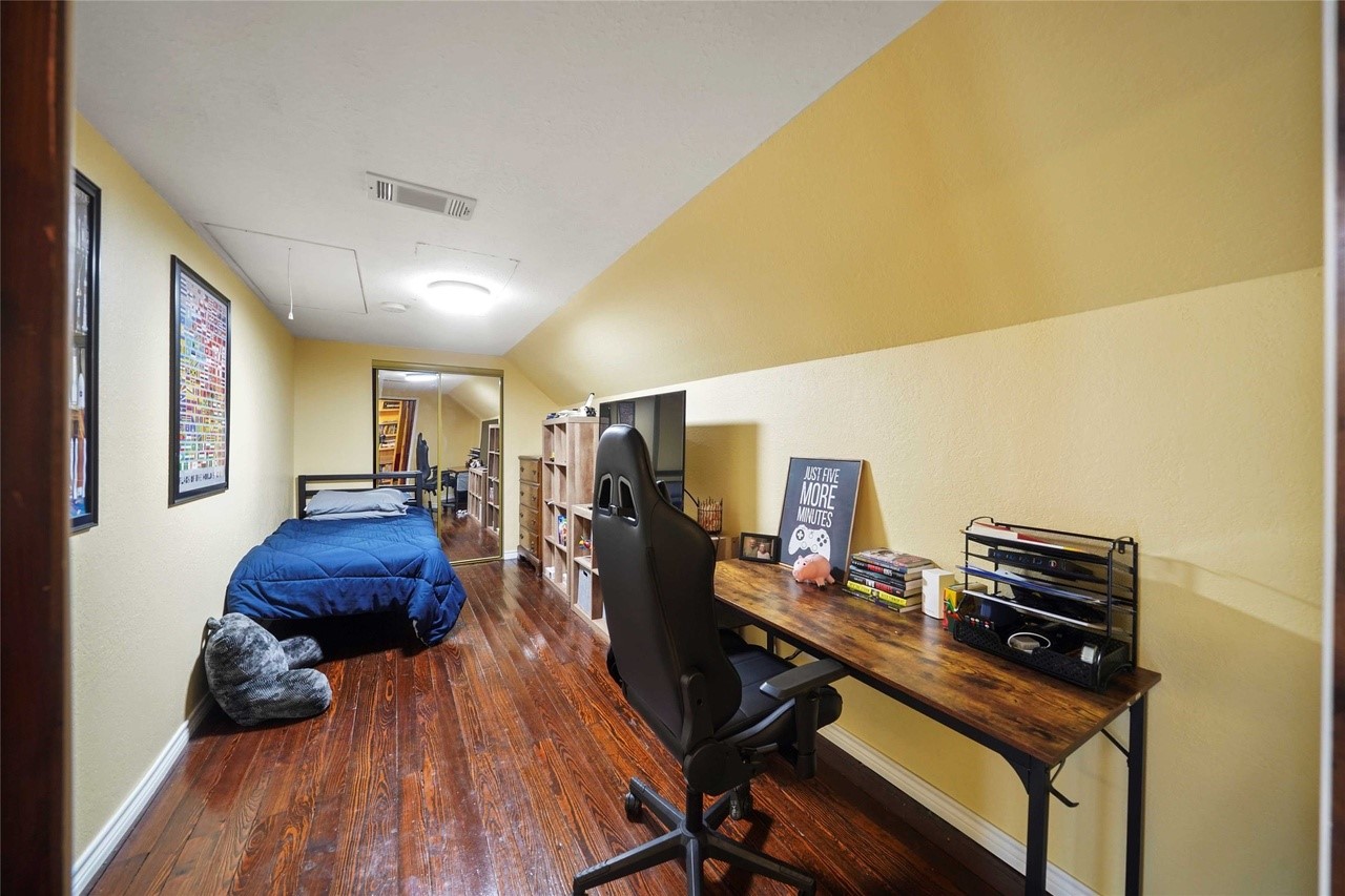 570 Wightman Street Matagorda, TX 77457 - Photo 24 of 29 a room with furniture and wooden floor