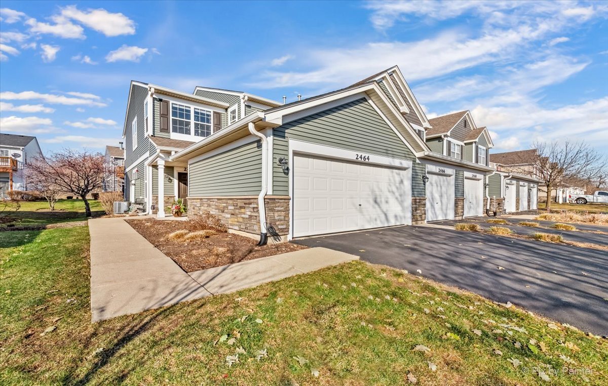 a front view of a house with a yard