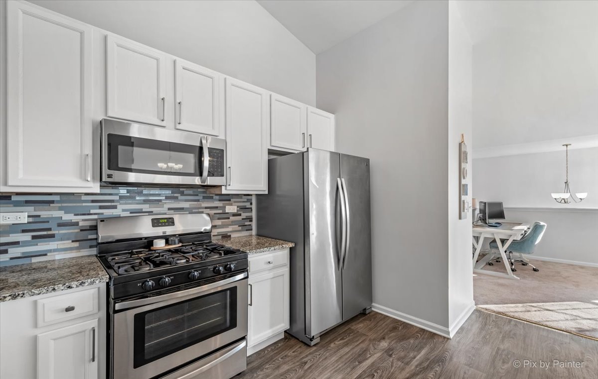 2464 Golf Ridge Circle, Unit 2464 Naperville, IL 60563 - Photo 11 of 28 a kitchen with a stove microwave and refrigerator