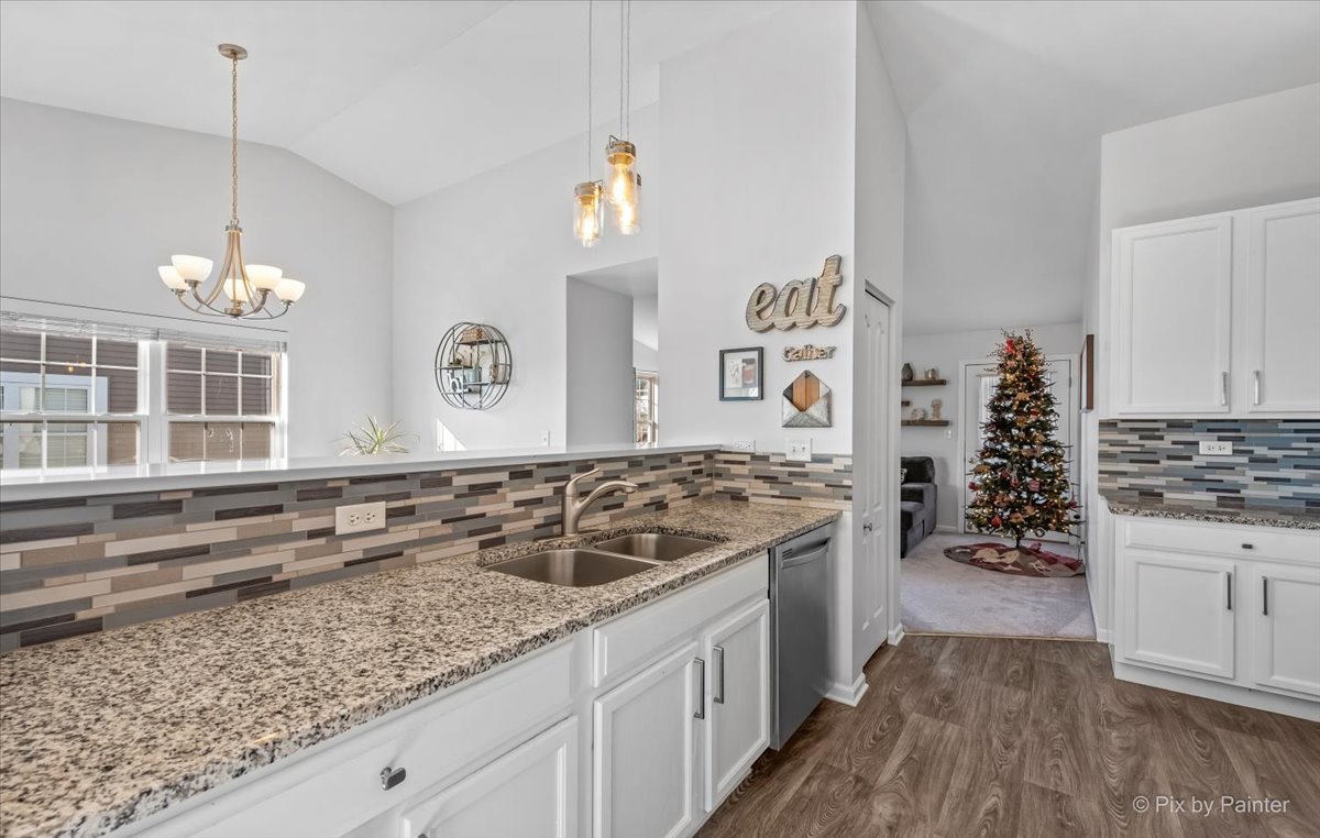 2464 Golf Ridge Circle, Unit 2464 Naperville, IL 60563 - Photo 12 of 28 a kitchen with a stove and a wooden floor