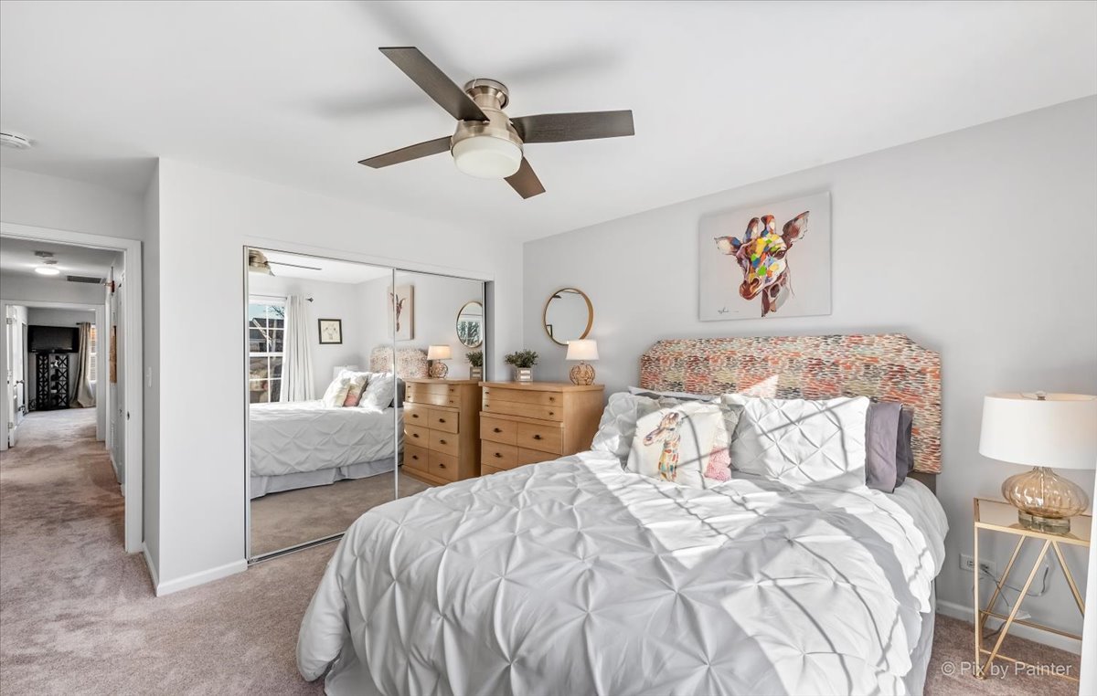2464 Golf Ridge Circle, Unit 2464 Naperville, IL 60563 - Photo 22 of 28 a bedroom with a bed and a view of kitchen