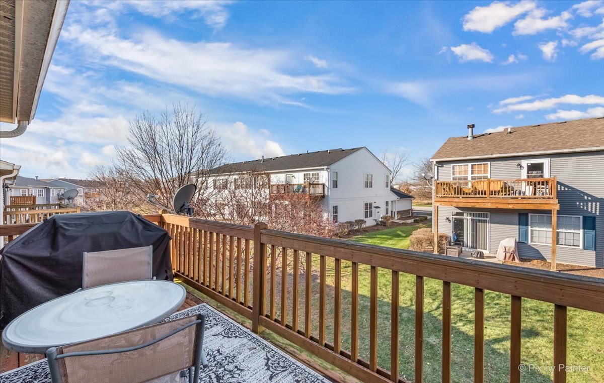 2464 Golf Ridge Circle, Unit 2464 Naperville, IL 60563 - Photo 25 of 28 a view of a balcony with chairs