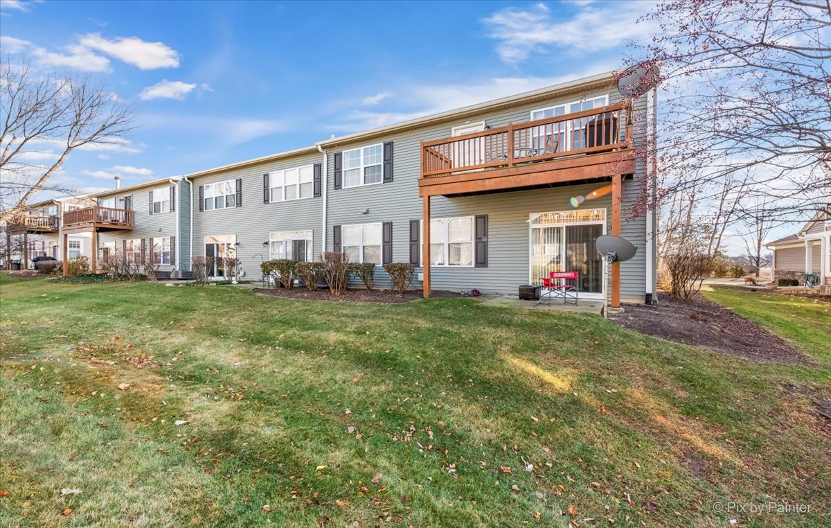 2464 Golf Ridge Circle, Unit 2464 Naperville, IL 60563 - Photo 28 of 28 a front view of building with yard