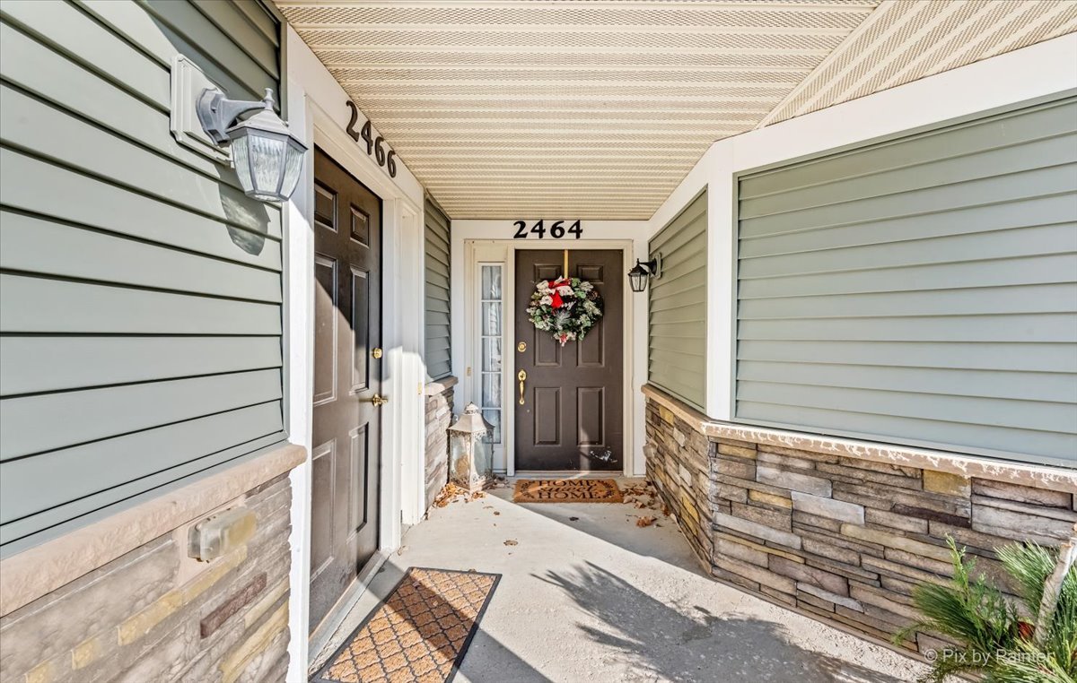 2464 Golf Ridge Circle, Unit 2464 Naperville, IL 60563 - Photo 4 of 28 a view of a porch with patio
