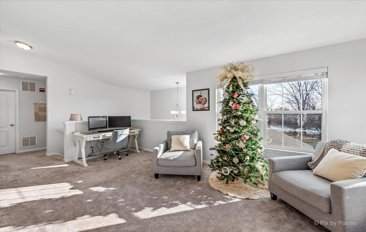 2464 Golf Ridge Circle, Unit 2464 Naperville, IL 60563 - Photo 6 of 28 a living room with furniture plant and a window