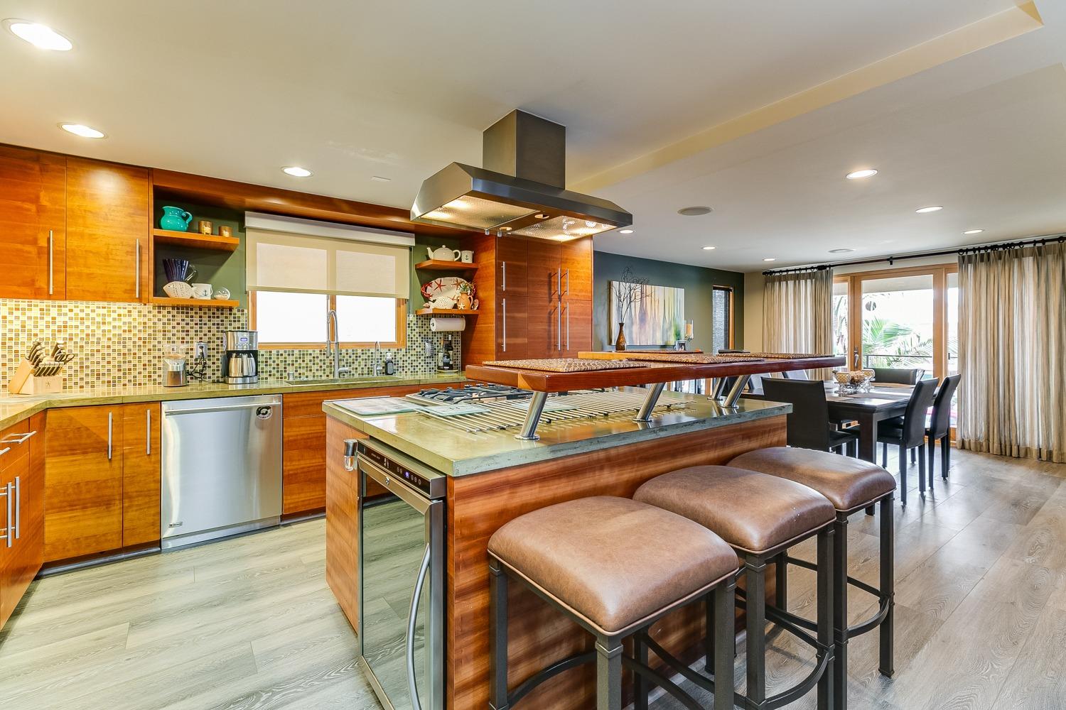 144 Pasadena Avenue Oxnard, CA 93035 - Photo 14 of 42 a kitchen with granite countertop lots of counter top space and stainless steel appliances
