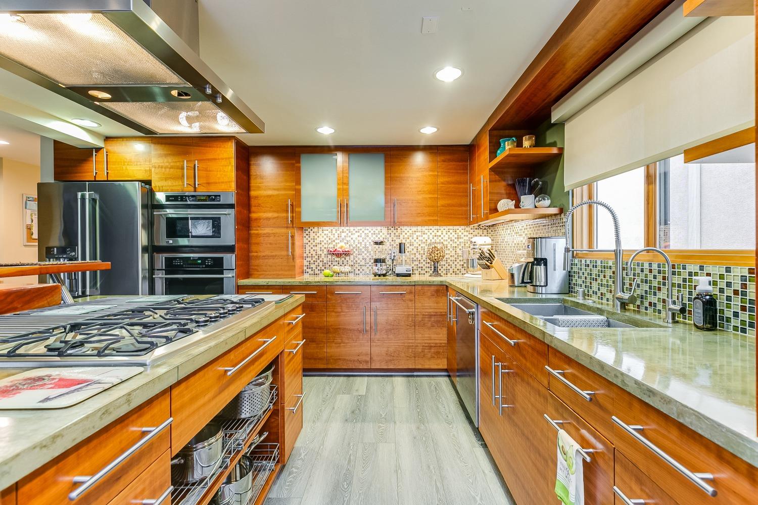 144 Pasadena Avenue Oxnard, CA 93035 - Photo 17 of 42 a kitchen with stainless steel appliances granite countertop a sink and a stove