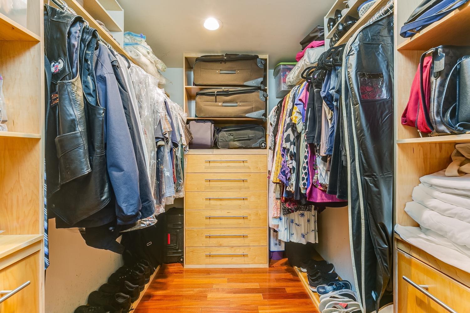 144 Pasadena Avenue Oxnard, CA 93035 - Photo 23 of 42 a view of walk in closet with clothes and shoes