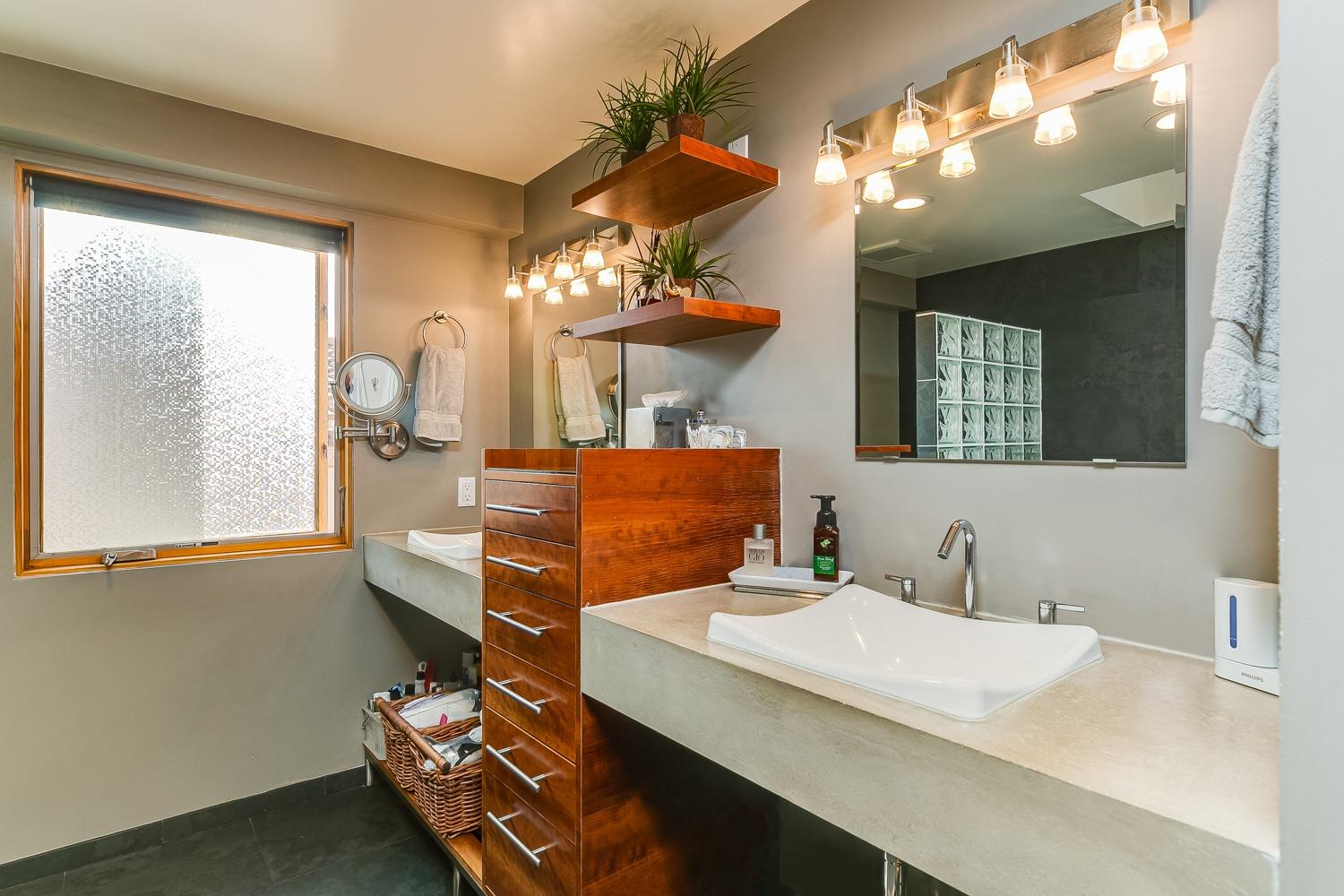 144 Pasadena Avenue Oxnard, CA 93035 - Photo 24 of 42 a bathroom with a sink vanity and mirror
