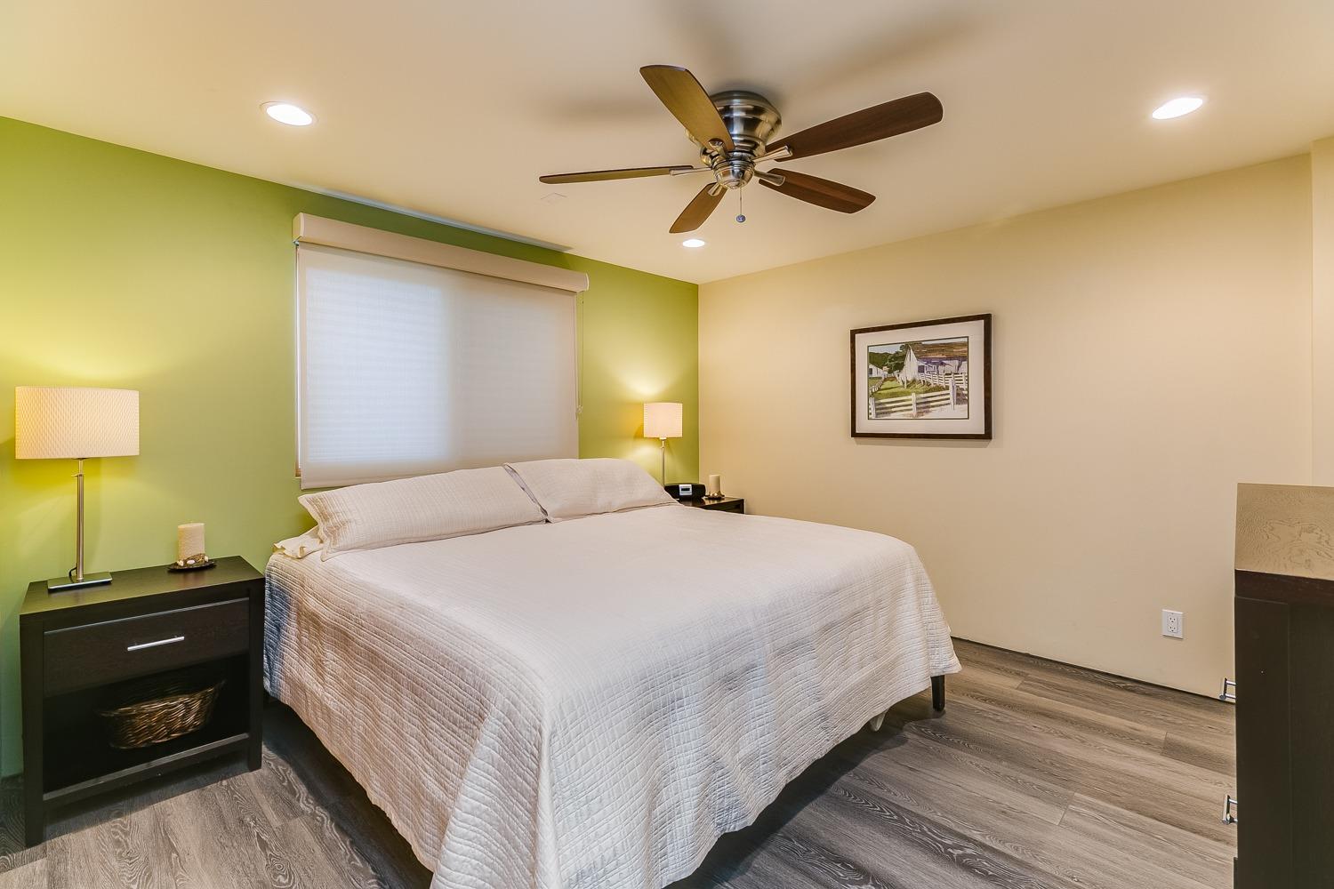 144 Pasadena Avenue Oxnard, CA 93035 - Photo 27 of 42 a bedroom with a bed and a lamp