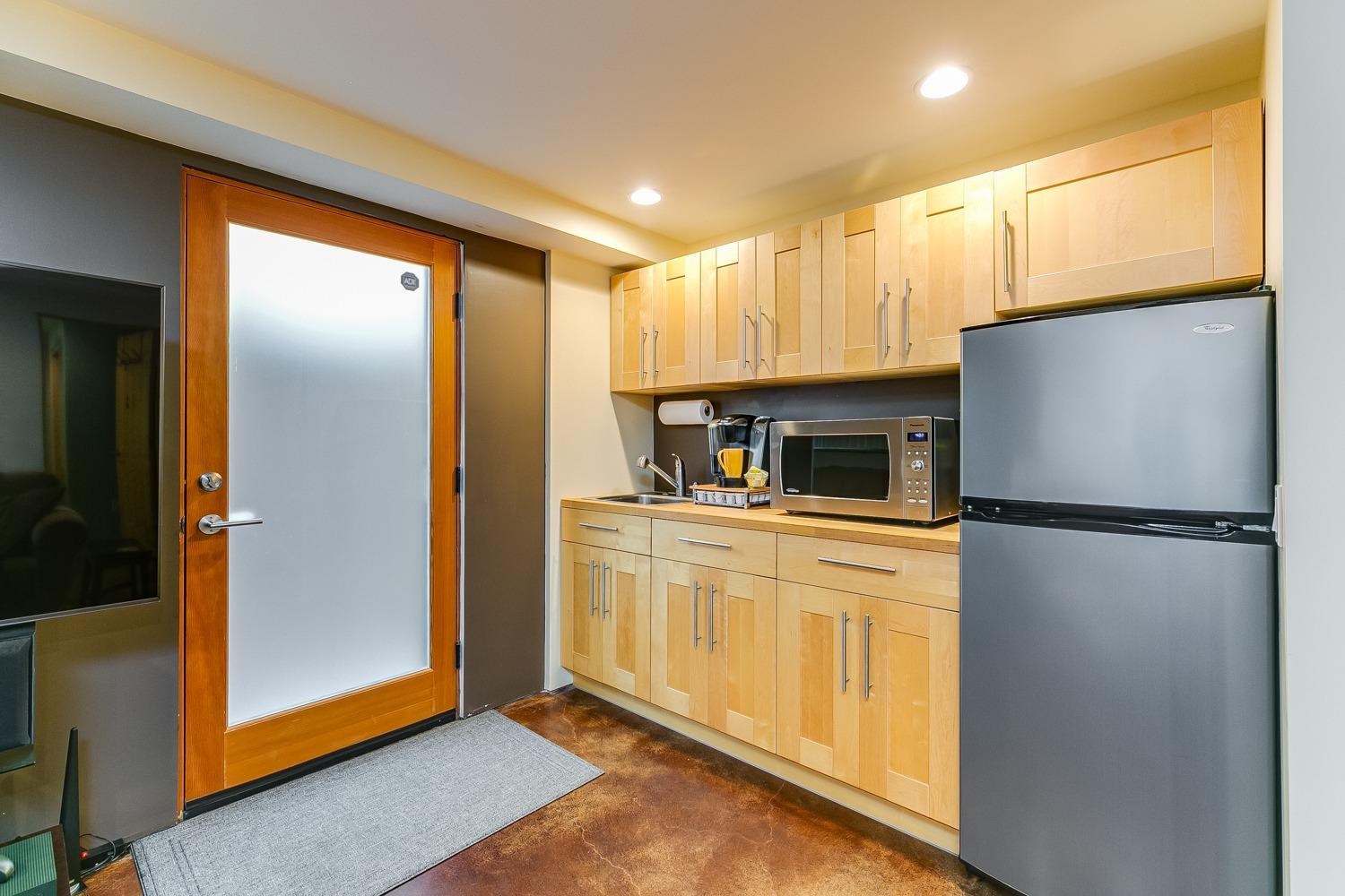 144 Pasadena Avenue Oxnard, CA 93035 - Photo 35 of 42 a kitchen with a refrigerator a microwave and sink