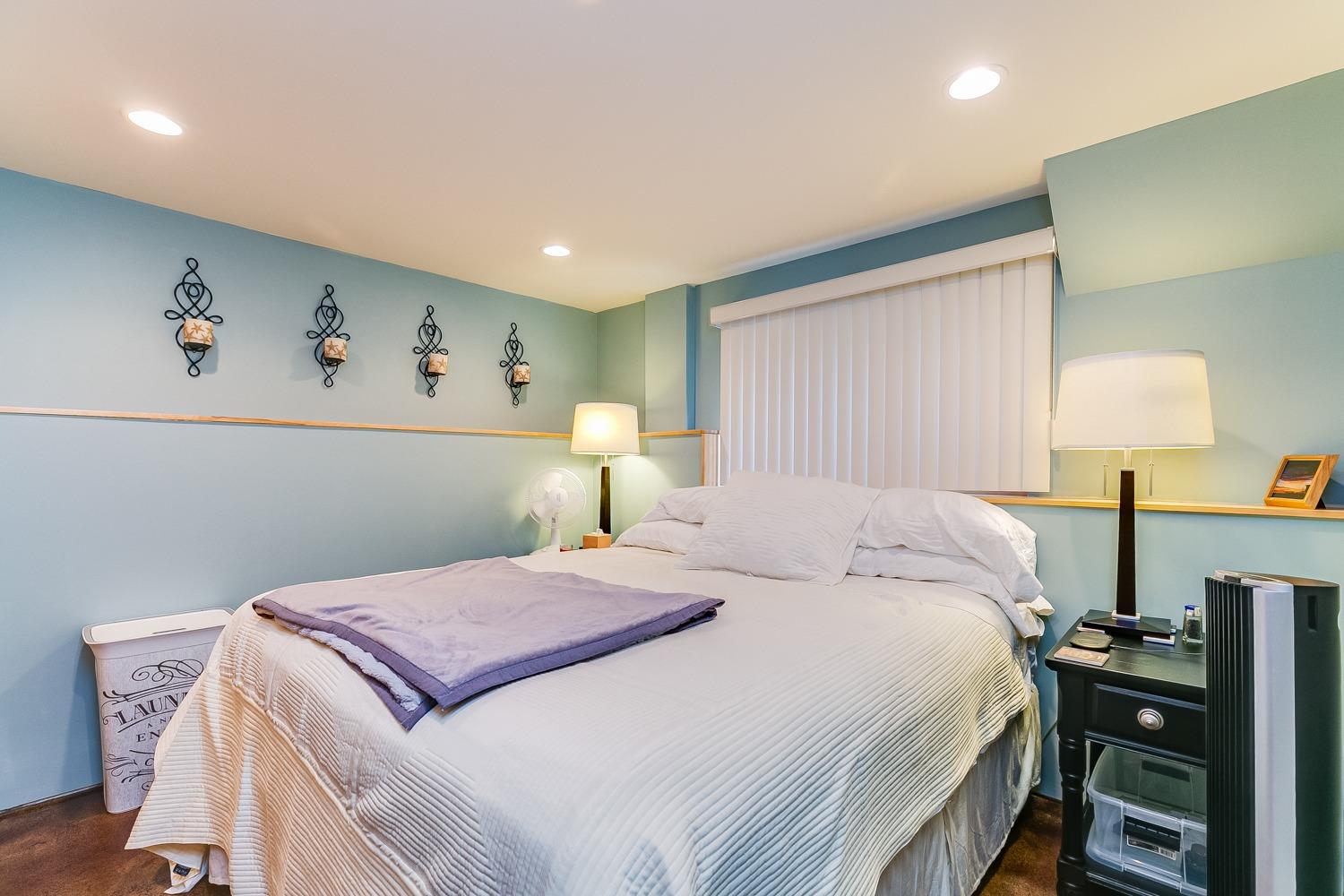 144 Pasadena Avenue Oxnard, CA 93035 - Photo 37 of 42 a bedroom with a bed and a table in it