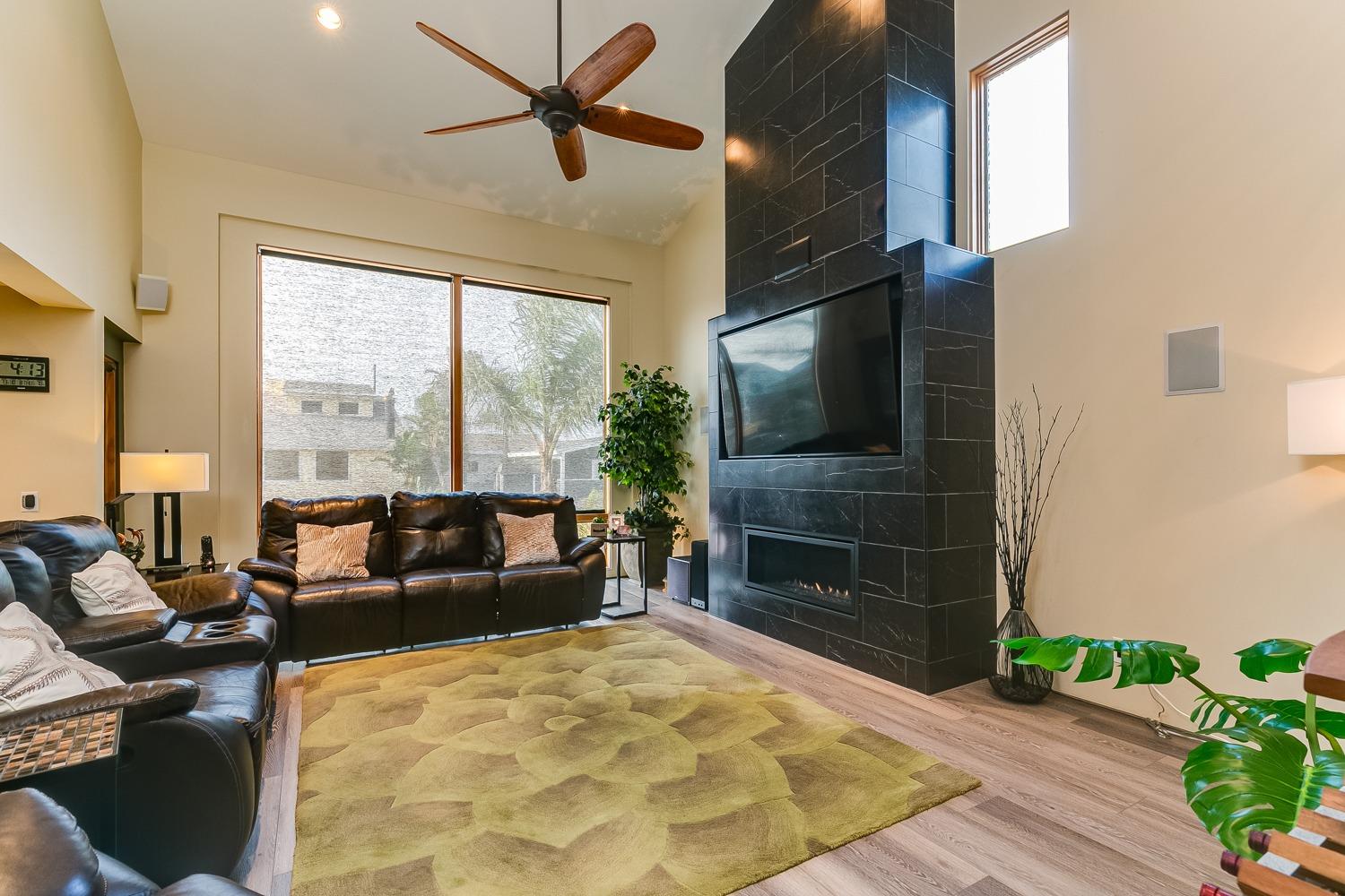 144 Pasadena Avenue Oxnard, CA 93035 - Photo 7 of 42 a living room with furniture tv and a fireplace