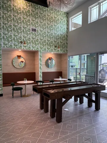 a living room with a wooden table and a table