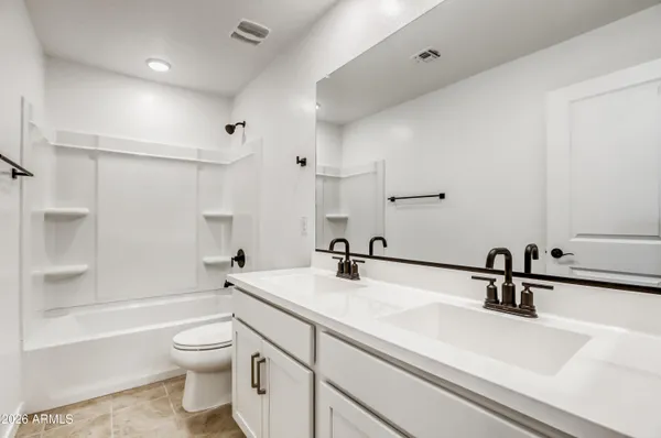 a bathroom with a sink a toilet and a bathtub