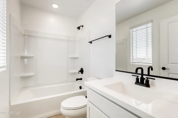 a bathroom with a sink a toilet and a bathtub