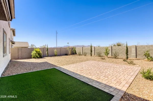 a view of a backyard of the house