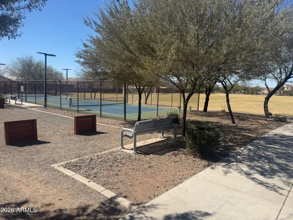 a view of a backyard with sitting area